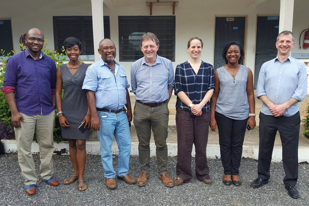 Photograph of four gentlemen and three ladies standing in a line for a photograph. They are staff from the Ghanaian Fisheries Commission with the AMR Reference Centre team.