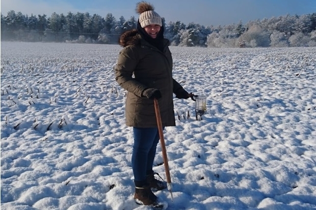 Image of Laura Chapman standing in a field covered in snow