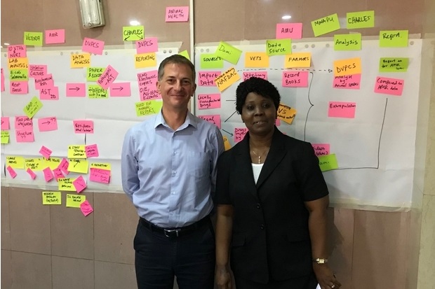 Image of Rod Card and Victoria Olusola Adetunji in front of a board of post-it notes