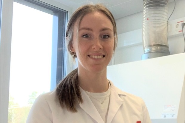 Image of a female scientist wearing a white coat