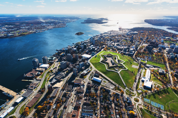 Aerial image of a town and a body of water.