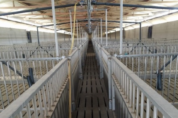 Image showing the inside of a barn. The barn is empty of animals.