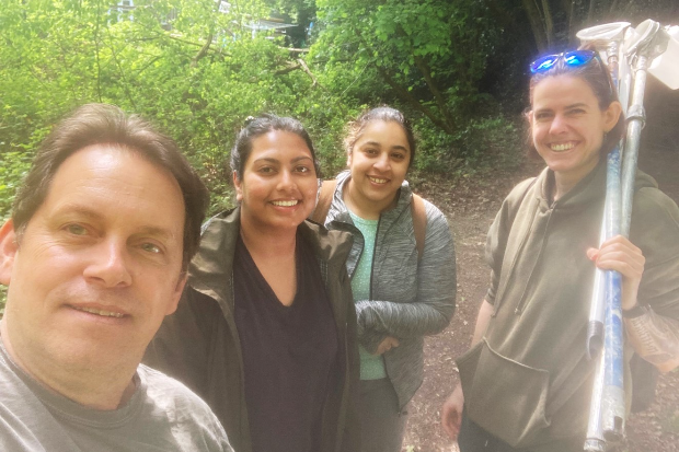 Group image of one male and three females in an outdoor setting