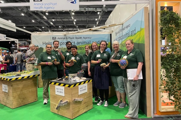 Image of a group of APHA staff posing for a photo at the APHA stand