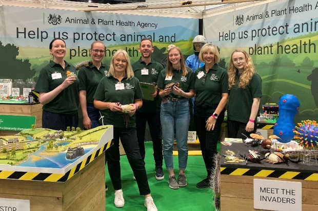 Image of a group of APHA staff posing for a photo at the APHA stand